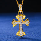 Gold cross pendant with diamonds on a blue background