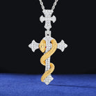 Jewelry pendant with cross and snake design on a blue and black background