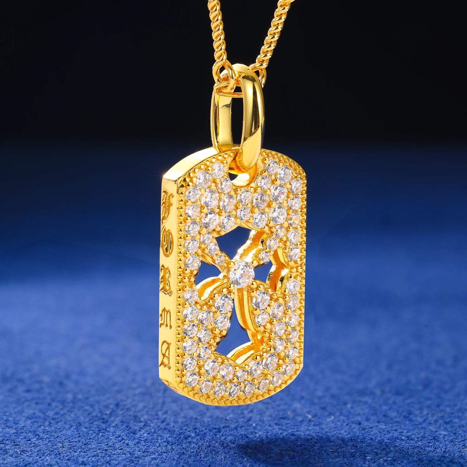 Gold pendant with intricate design on a blue background